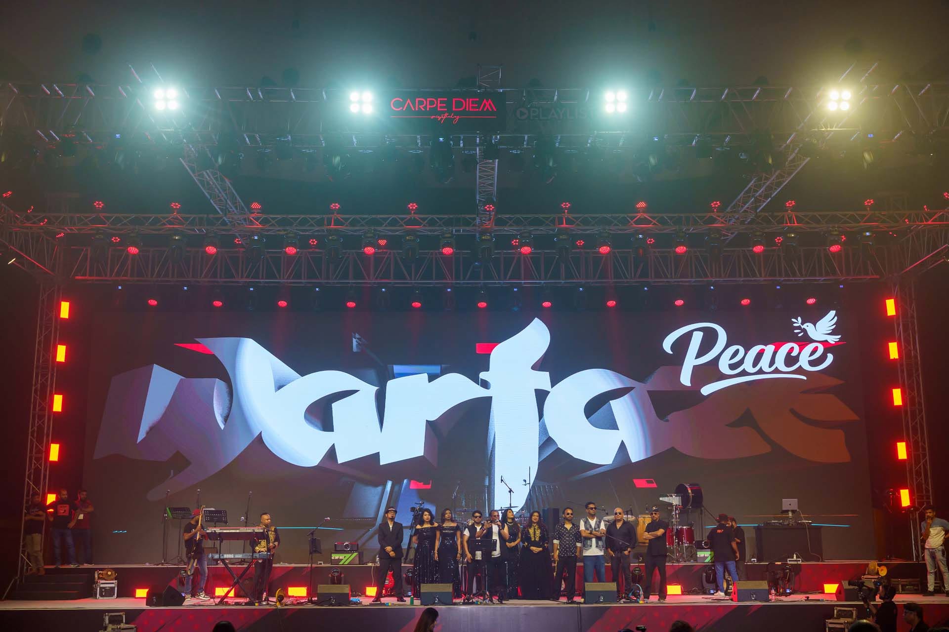 Warfaze performing on the full stage with LED wall and lighting rig during the Michael Jackson tribute production in Dhaka