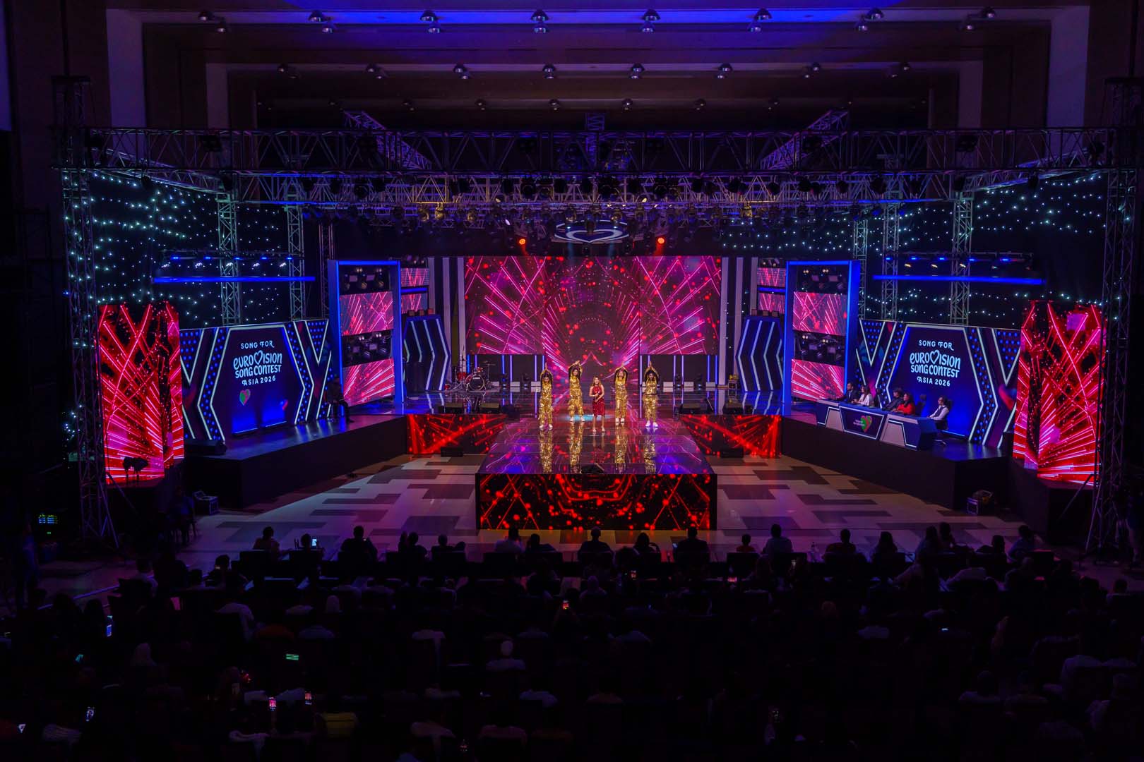Eurovision Asia Voice of Bangladesh: Visuals by Studio Z BD 3 Red and pink geometric LED visuals behind a performing group